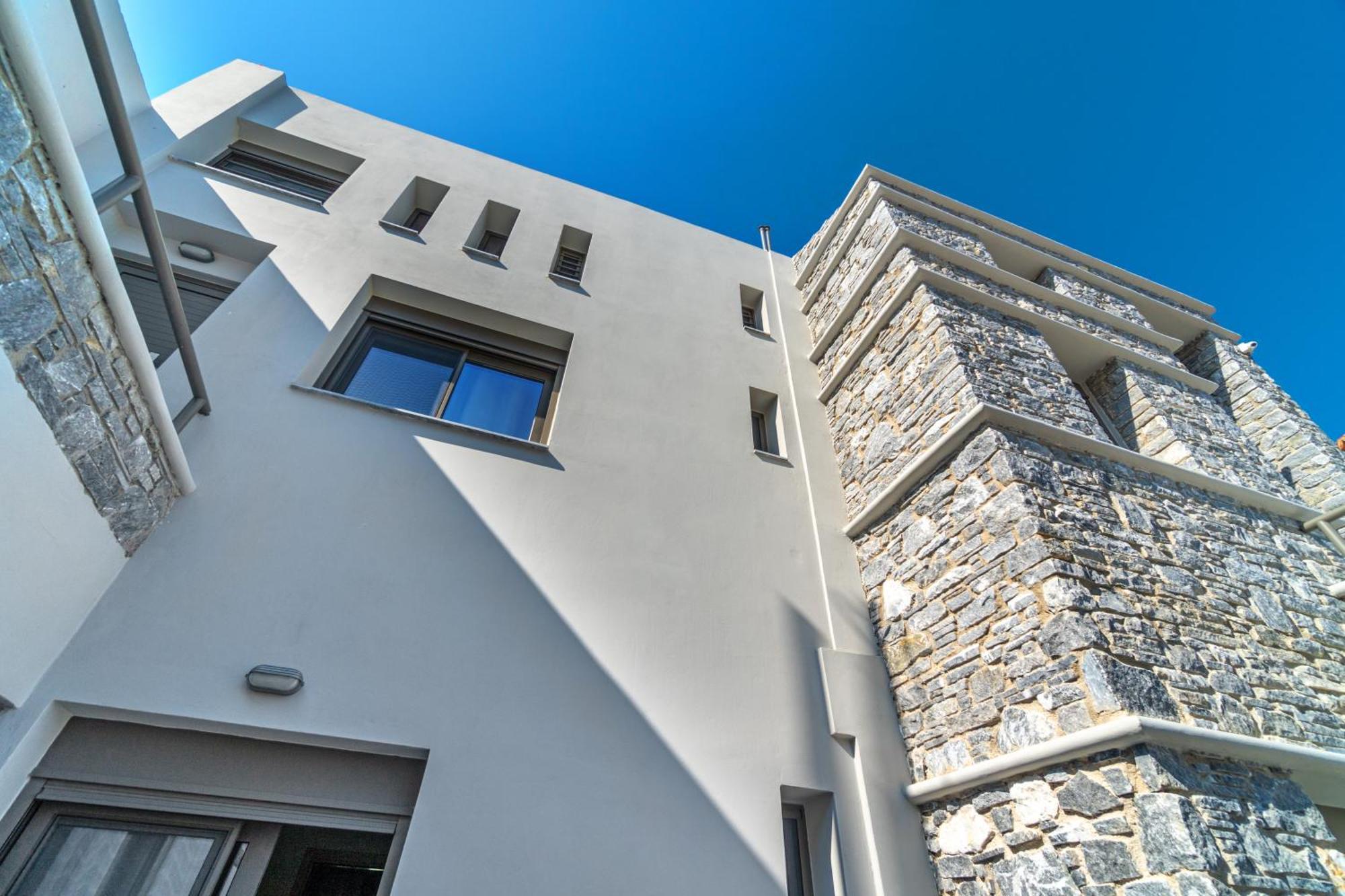 La Perla Suites Agioi Apostoli Extérieur photo